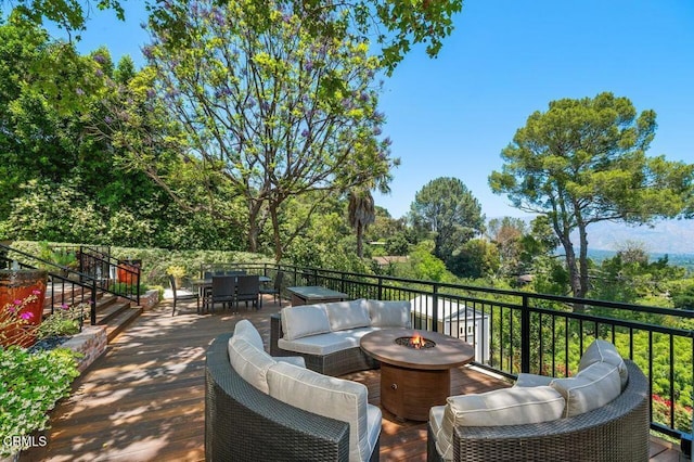 320 N San Rafael Ave, Pasadena, CA 91105 - view of patio with a deck, outdoor dining area, an outdoor living space with a fire pit, and view of scattered trees