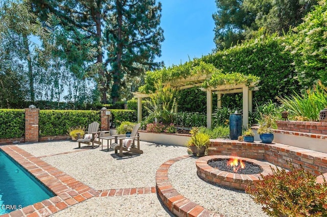 320 N San Rafael Ave, Pasadena, CA 91105 - view of patio with a fire pit and a pergola