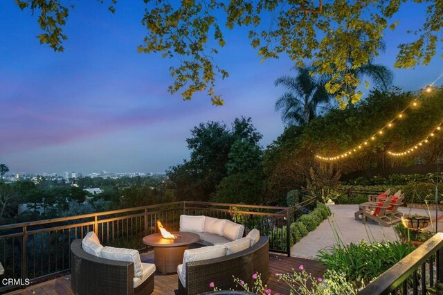 320 N San Rafael Ave, Pasadena, CA 91105 - deck at dusk with an outdoor living space with a fire pit