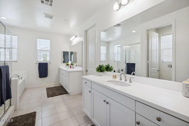 113 Azalea St, Fillmore, CA 93015 - full bath with a stall shower, plenty of natural light, two vanities, a garden tub, and recessed lighting