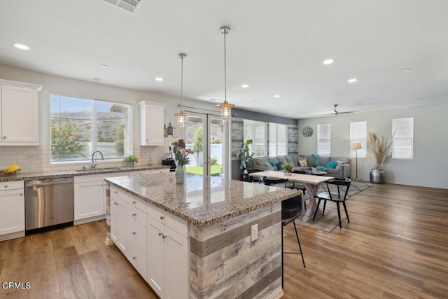 113 Azalea St, Fillmore, CA 93015 - kitchen with stainless steel dishwasher, plenty of natural light, a kitchen island, light wood-style floors, and recessed lighting