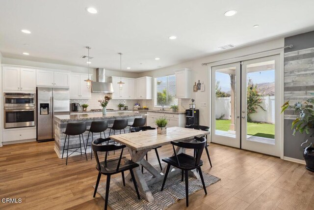 113 Azalea St, Fillmore, CA 93015 - dining area with light wood finished floors, recessed lighting, and french doors