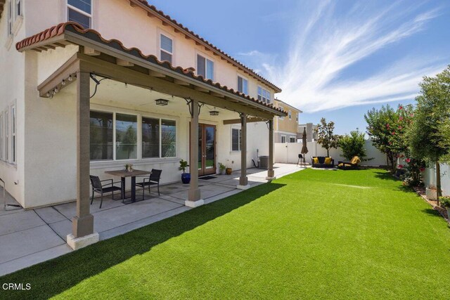 113 Azalea St, Fillmore, CA 93015 - rear view of property featuring a fenced backyard, stucco siding, a patio, and a tiled roof