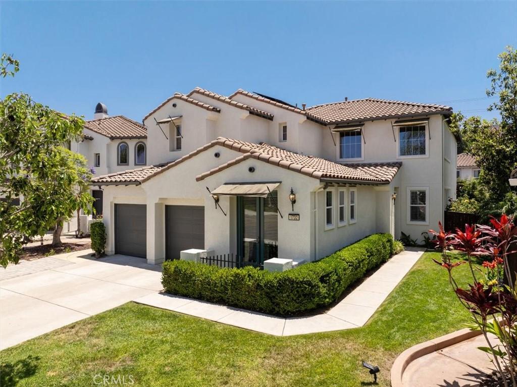 1732 Star Crest Pl, San Marcos, CA 92078 - view of front of house featuring a garage, stucco siding, concrete driveway, a tile roof, and a front lawn