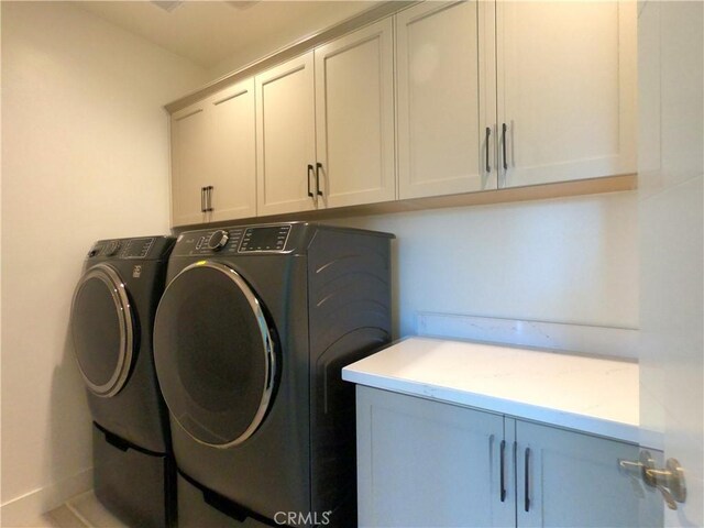 39460 Chamise St, Temecula, CA 92591 - laundry room featuring cabinet space and washing machine and dryer