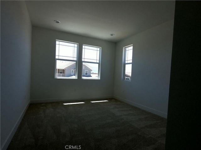 39460 Chamise St, Temecula, CA 92591 - empty room with dark colored carpet and baseboards