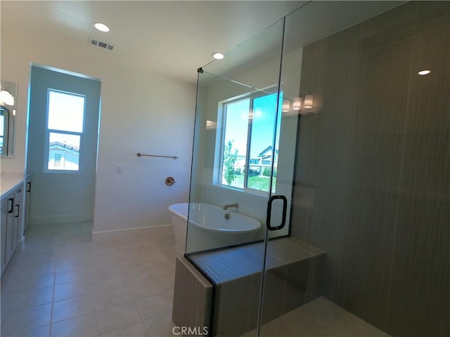 39460 Chamise St, Temecula, CA 92591 - full bath with vanity, healthy amount of natural light, a shower stall, and a soaking tub