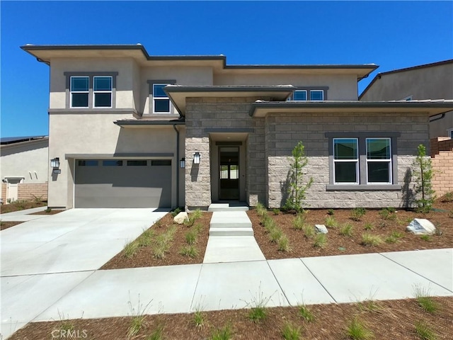 39460 Chamise St, Temecula, CA 92591 - prairie-style house with stucco siding, a garage, stone siding, and concrete driveway