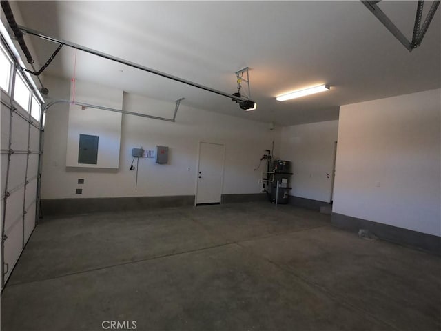 39460 Chamise St, Temecula, CA 92591 - garage featuring electric panel, water heater, and a garage door opener