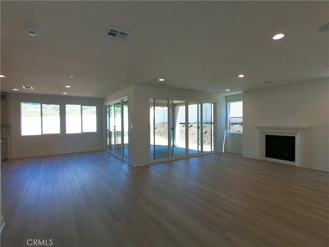 39460 Chamise St, Temecula, CA 92591 - unfurnished living room featuring wood finished floors, healthy amount of natural light, recessed lighting, and a fireplace