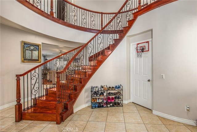 190 Cross Rail Ln, Norco, CA 92860 - staircase featuring tile patterned flooring, a high ceiling, and ceiling fan