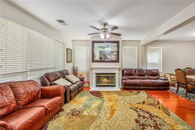 190 Cross Rail Ln, Norco, CA 92860 - living room with wood finished floors, ceiling fan, and a glass covered fireplace