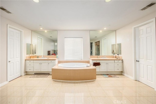 190 Cross Rail Ln, Norco, CA 92860 - full bath with a garden tub, two vanities, recessed lighting, and tile patterned flooring