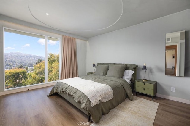 3233 Tareco Dr, Los Angeles, CA 90068 - bedroom featuring wood finished floors and baseboards