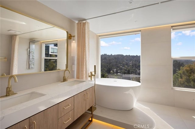 3233 Tareco Dr, Los Angeles, CA 90068 - bathroom with a freestanding tub, double vanity, and plenty of natural light