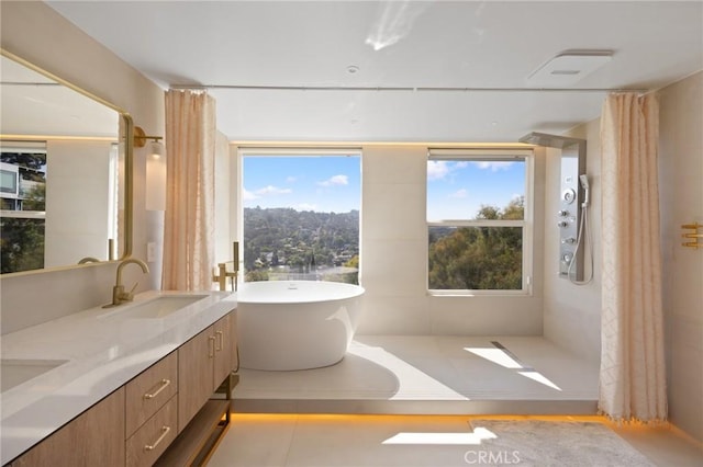 3233 Tareco Dr, Los Angeles, CA 90068 - bathroom with a freestanding tub, plenty of natural light, double vanity, and curtained shower