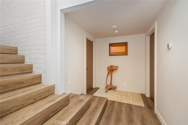 3233 Tareco Dr, Los Angeles, CA 90068 - hallway featuring wood finished floors and stairs