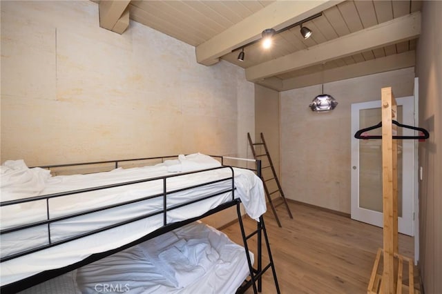 3233 Tareco Dr, Los Angeles, CA 90068 - bedroom with wood finished floors, a wood ceiling with exposed beams, and track lighting