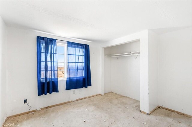 475 Fair Acres, Landers, CA 92285 - unfurnished bedroom with a closet and concrete floors