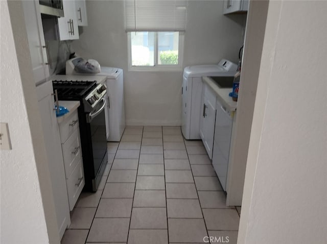 9240 Date St Unit 10A, Fontana, CA 92335 - kitchen featuring gas stove, separate washer and dryer, white cabinets, light countertops, and light tile patterned floors