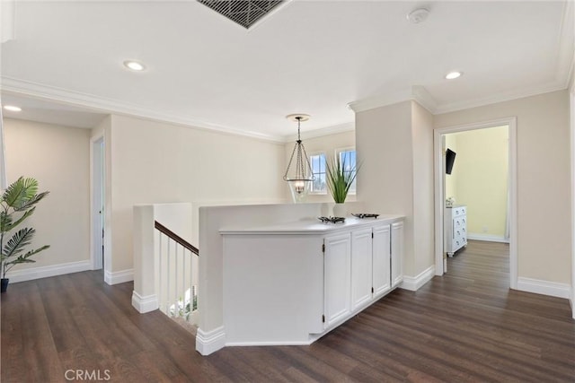 36 Via Tronido, Rancho Santa Margarita, CA 92688 - corridor with dark wood finished floors, crown molding, an upstairs landing, and recessed lighting