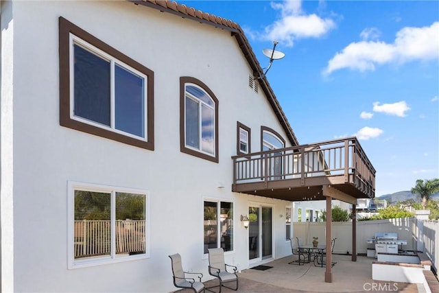36 Via Tronido, Rancho Santa Margarita, CA 92688 - rear view of property featuring stucco siding and a patio area