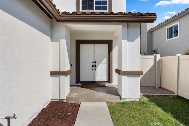 36 Via Tronido, Rancho Santa Margarita, CA 92688 - property entrance featuring stucco siding and a tiled roof