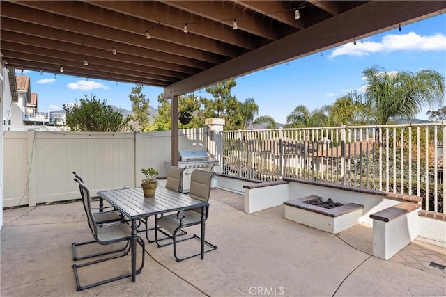 36 Via Tronido, Rancho Santa Margarita, CA 92688 - fenced backyard with a patio, an outdoor fire pit, and exterior kitchen