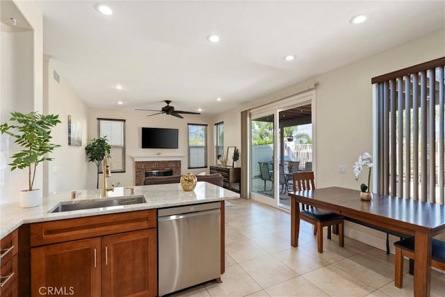36 Via Tronido, Rancho Santa Margarita, CA 92688 - kitchen featuring dishwasher, a ceiling fan, a fireplace, recessed lighting, and light stone countertops