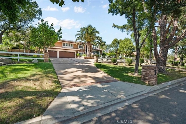 10920 Beechwood Dr, Rancho Cucamonga, CA 91737 - view of front of property featuring driveway, stucco siding, and a tiled roof