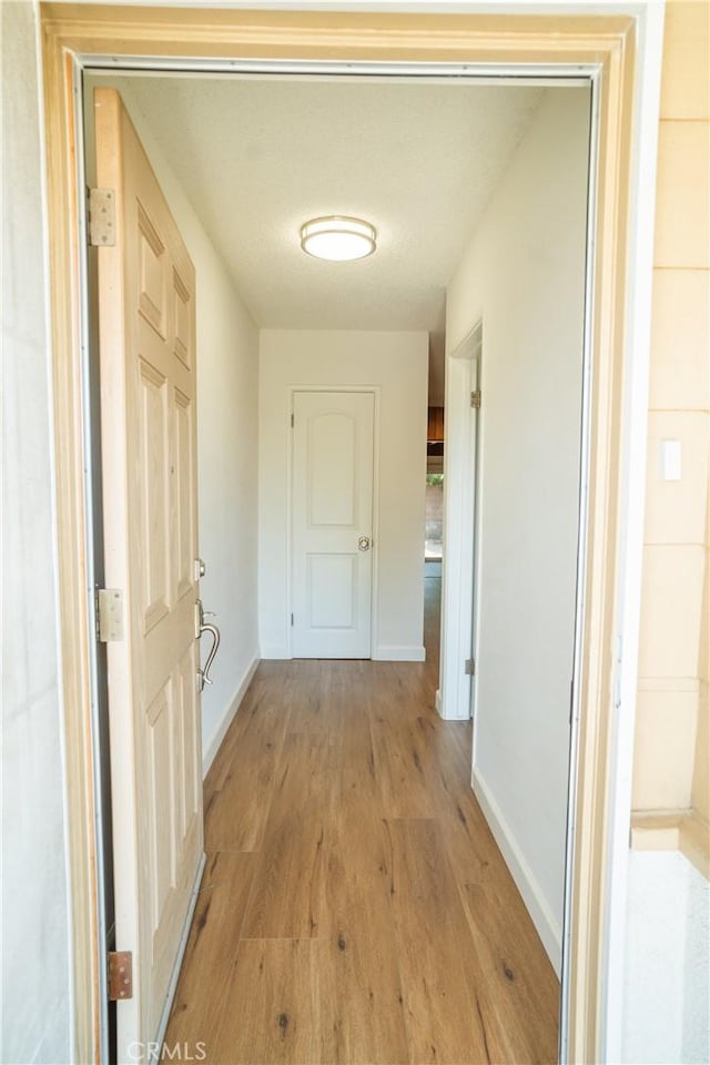18126 S Denker Ave, Gardena, CA 90248 - hall featuring light wood finished floors and baseboards