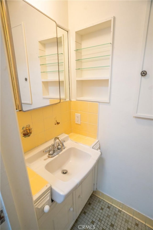 18126 S Denker Ave, Gardena, CA 90248 - bathroom featuring backsplash, tile patterned floors, and vanity