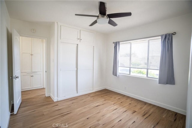 18126 S Denker Ave, Gardena, CA 90248 - unfurnished bedroom with light wood-style flooring, a closet, and a ceiling fan