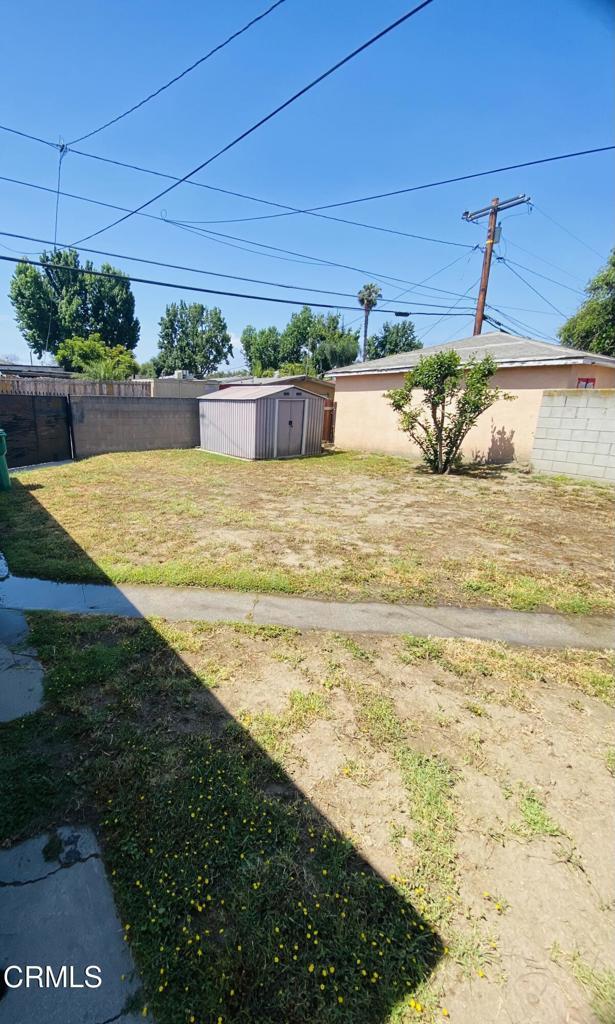 272 E 69th St, Long Beach, CA 90805 - view of yard with a storage unit