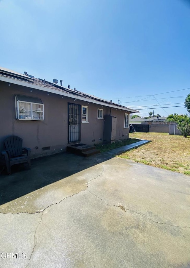 272 E 69th St, Long Beach, CA 90805 - view of front of property with crawl space, a patio, and stucco siding