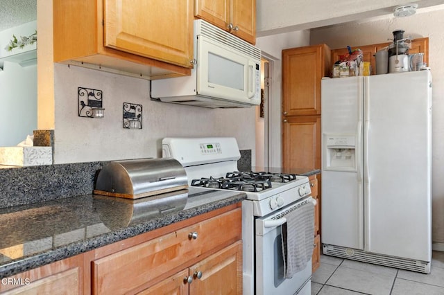 272 E 69th St, Long Beach, CA 90805 - kitchen with white appliances and light tile patterned floors
