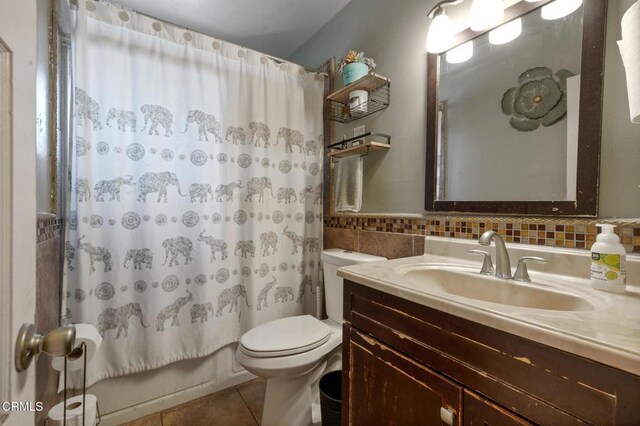 272 E 69th St, Long Beach, CA 90805 - bathroom with tile patterned floors, vanity, tile walls, and shower / bath combination with curtain