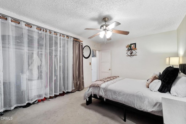 272 E 69th St, Long Beach, CA 90805 - bedroom featuring carpet, a textured ceiling, and a ceiling fan
