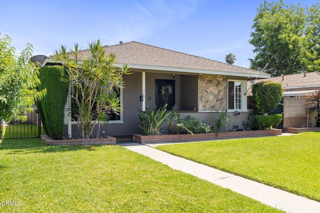272 E 69th St, Long Beach, CA 90805 - bungalow with stucco siding, a shingled roof, and stone siding