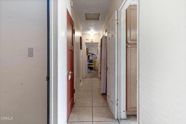 272 E 69th St, Long Beach, CA 90805 - hall with a textured ceiling and light tile patterned floors