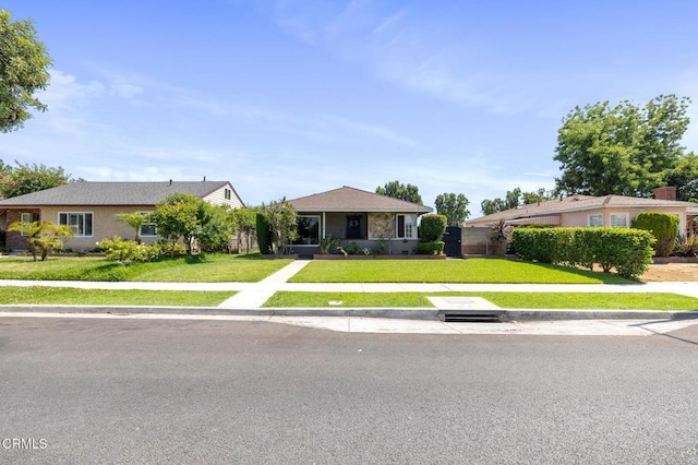 272 E 69th St, Long Beach, CA 90805 - single story home featuring a front yard and stucco siding