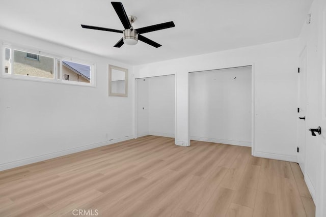7812 Fairchild Ave, Winnetka, CA 91306 - unfurnished bedroom featuring multiple closets, light wood finished floors, and a ceiling fan