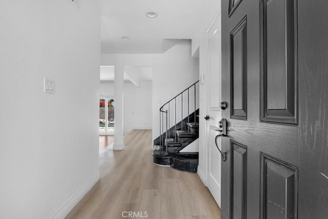 7812 Fairchild Ave, Winnetka, CA 91306 - entrance foyer with light wood finished floors and stairway