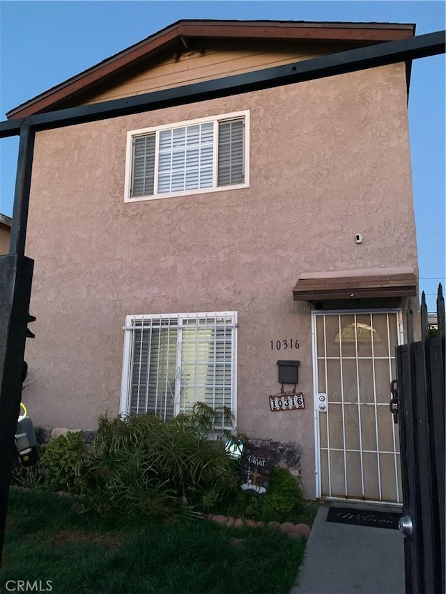 10316 S San Pedro St, Los Angeles, CA 90003 - property entrance featuring stucco siding