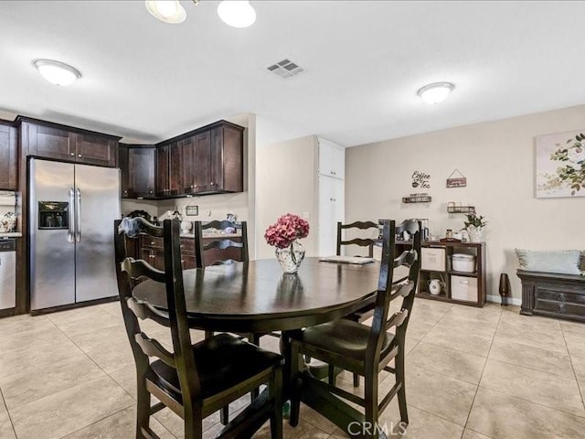10316 S San Pedro St, Los Angeles, CA 90003 - dining space featuring light tile patterned floors