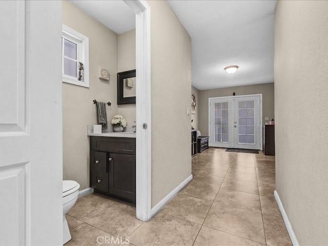 10316 S San Pedro St, Los Angeles, CA 90003 - hallway featuring french doors and light tile patterned floors