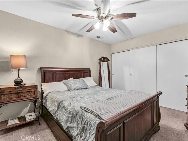 10316 S San Pedro St, Los Angeles, CA 90003 - bedroom featuring light carpet, a closet, and ceiling fan