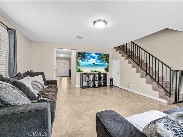 10316 S San Pedro St, Los Angeles, CA 90003 - living room with light tile patterned floors and stairs