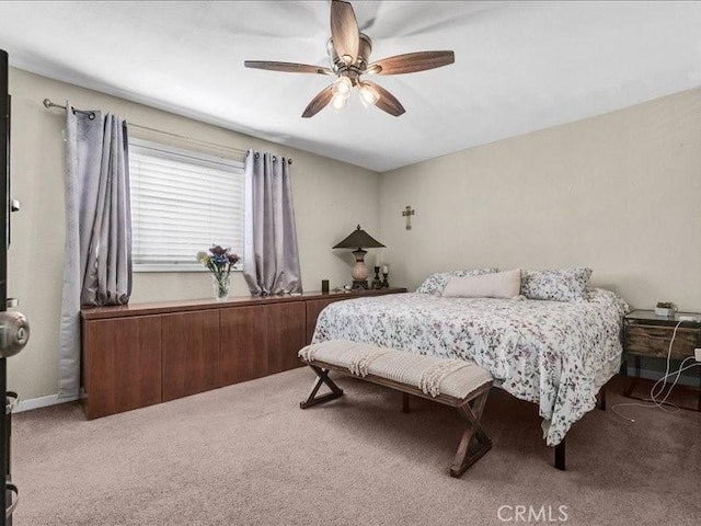 10316 S San Pedro St, Los Angeles, CA 90003 - carpeted bedroom with a ceiling fan