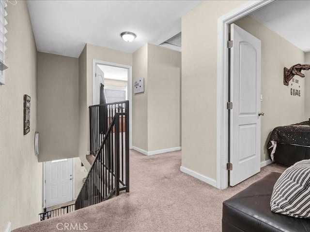 10316 S San Pedro St, Los Angeles, CA 90003 - hallway featuring an upstairs landing and carpet floors